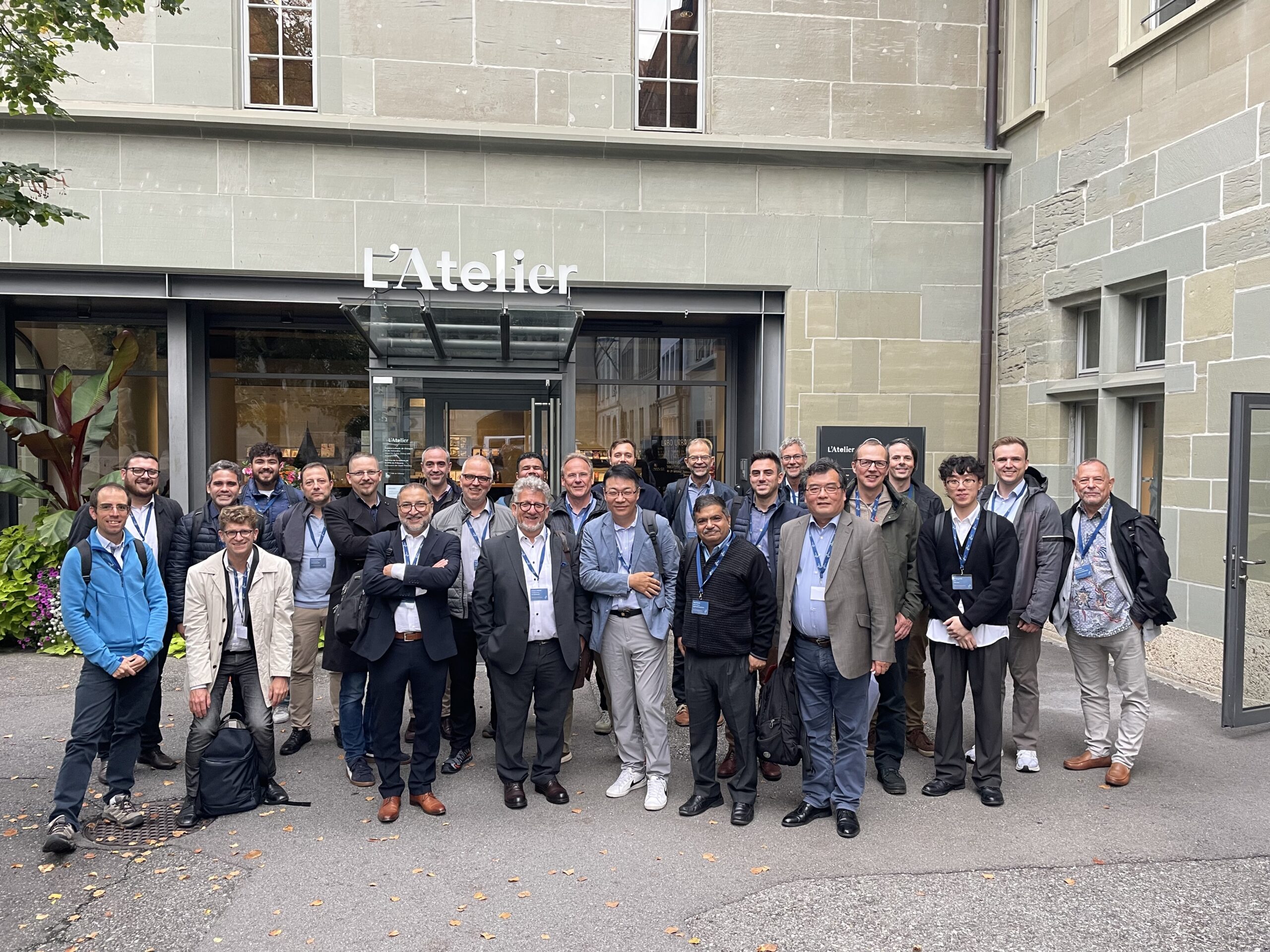 Group photo of participants at the MCm Sales Partners Meeting 2025 in Fribourg, Switzerland, celebrating global collaboration and innovation.