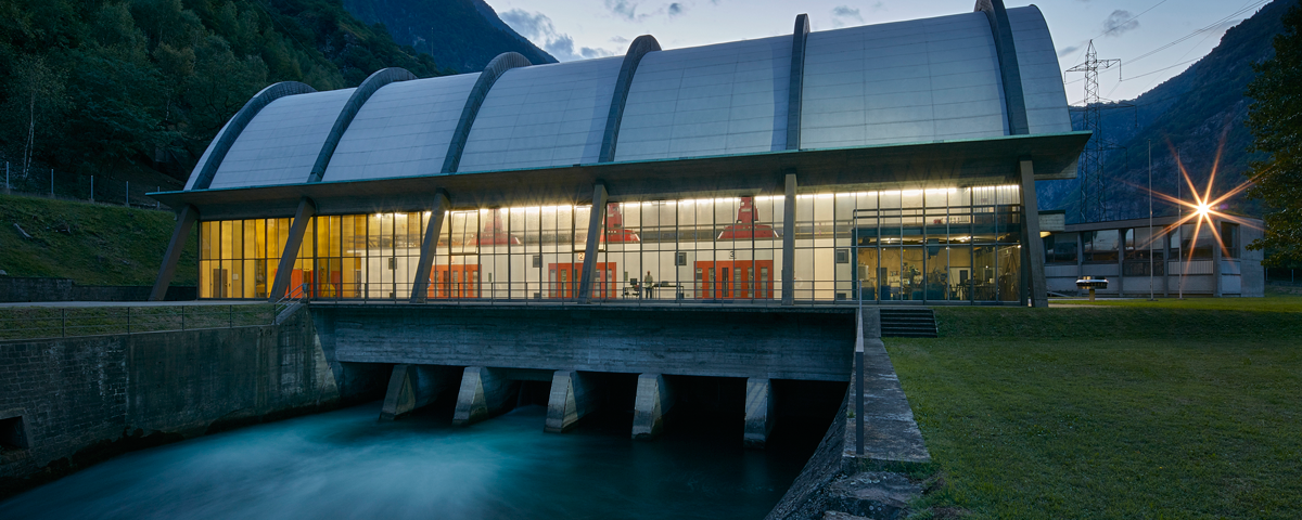 Nuova Biaschina Hydro Power Plant at dusk, showcasing its modernized infrastructure and sustainable energy production in Ticino, Switzerland.